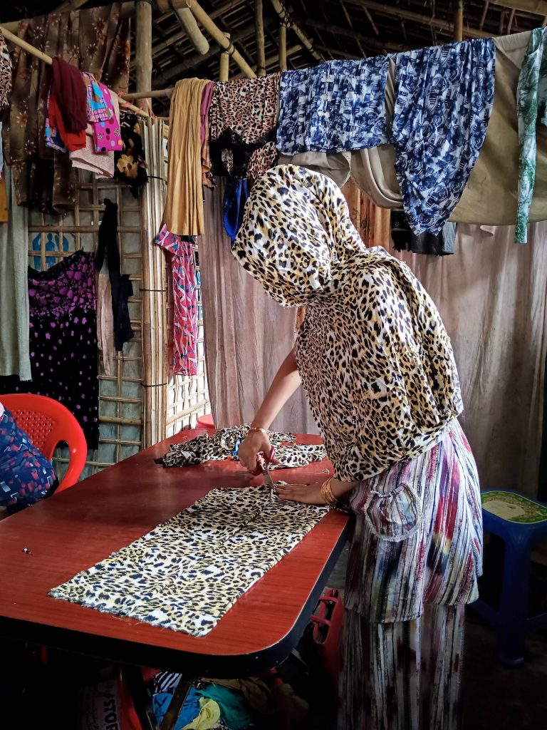 talented tailor, creates capivating dresses